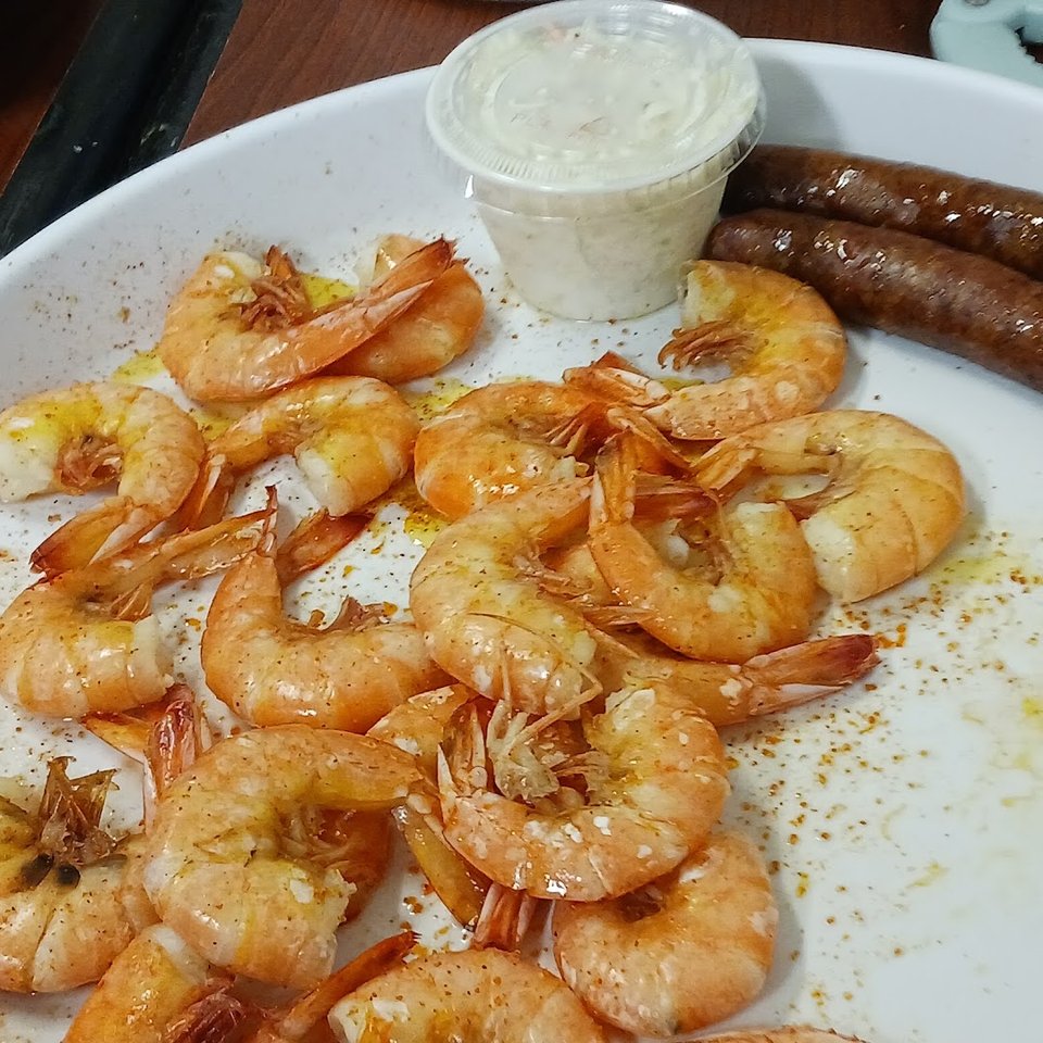 Crispy shrimp and hush puppies served together.