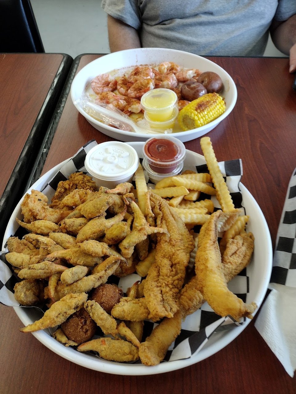 Counter menu featuring fried fish and shrimp burgers.