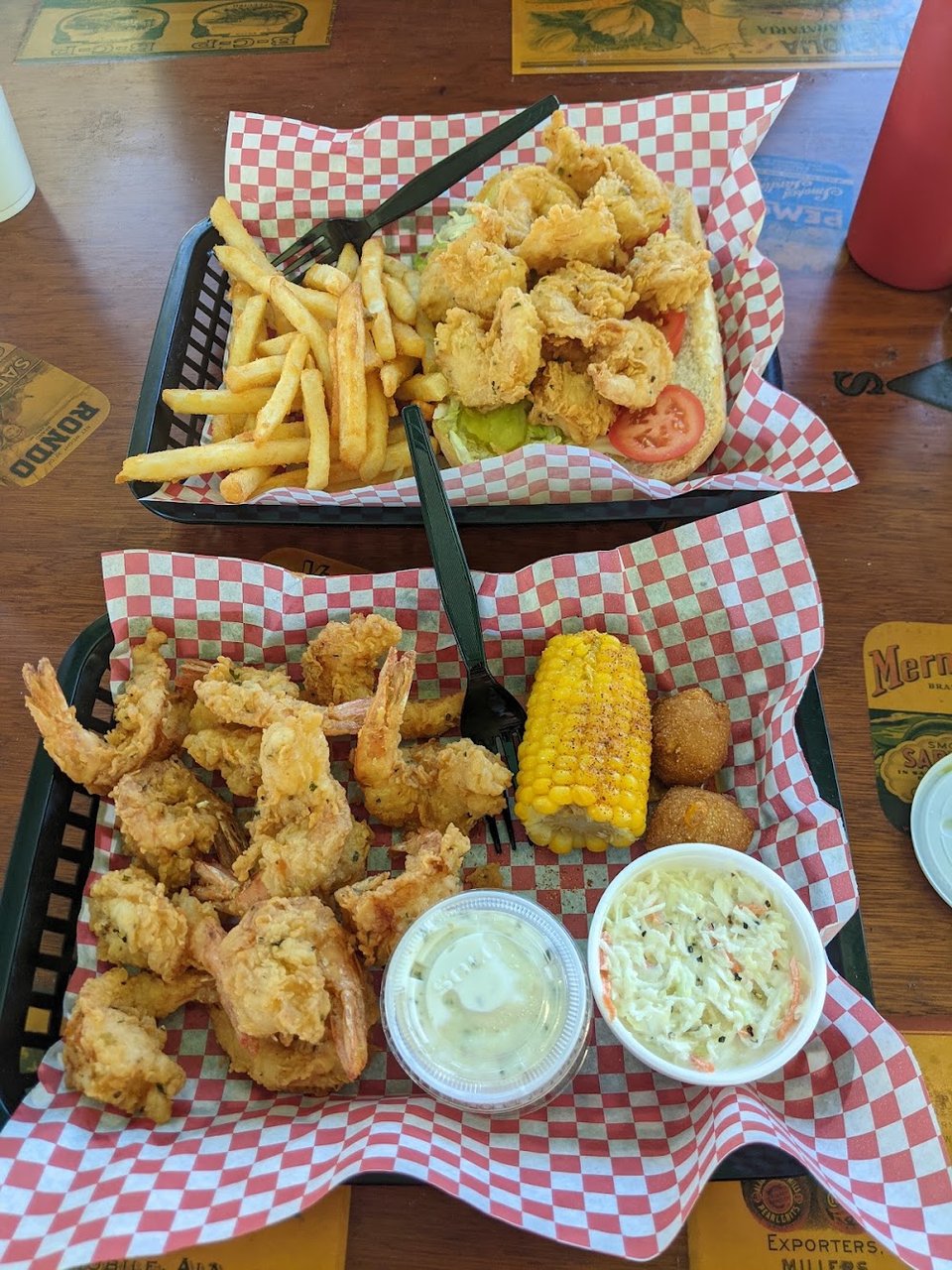 Menu board with fried seafood platters and burgers.