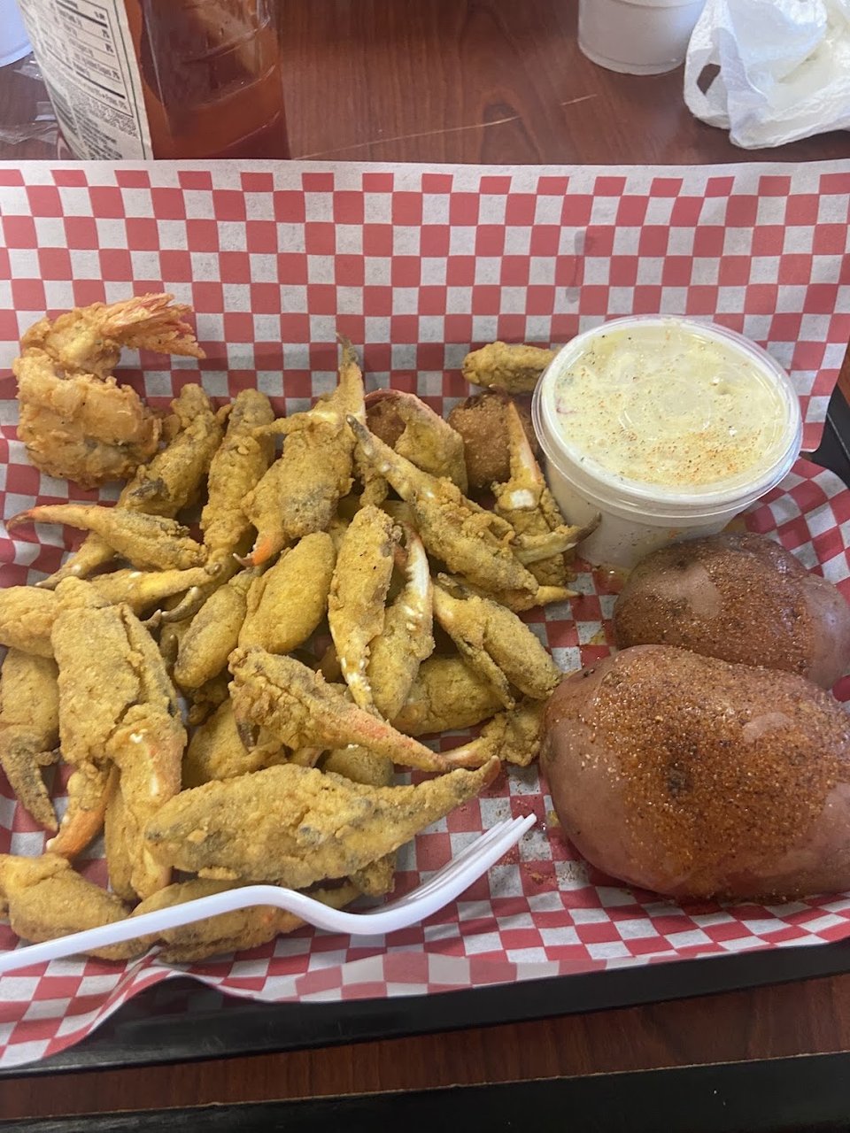 Seafood menu showing shrimp, oysters, and crab claws.