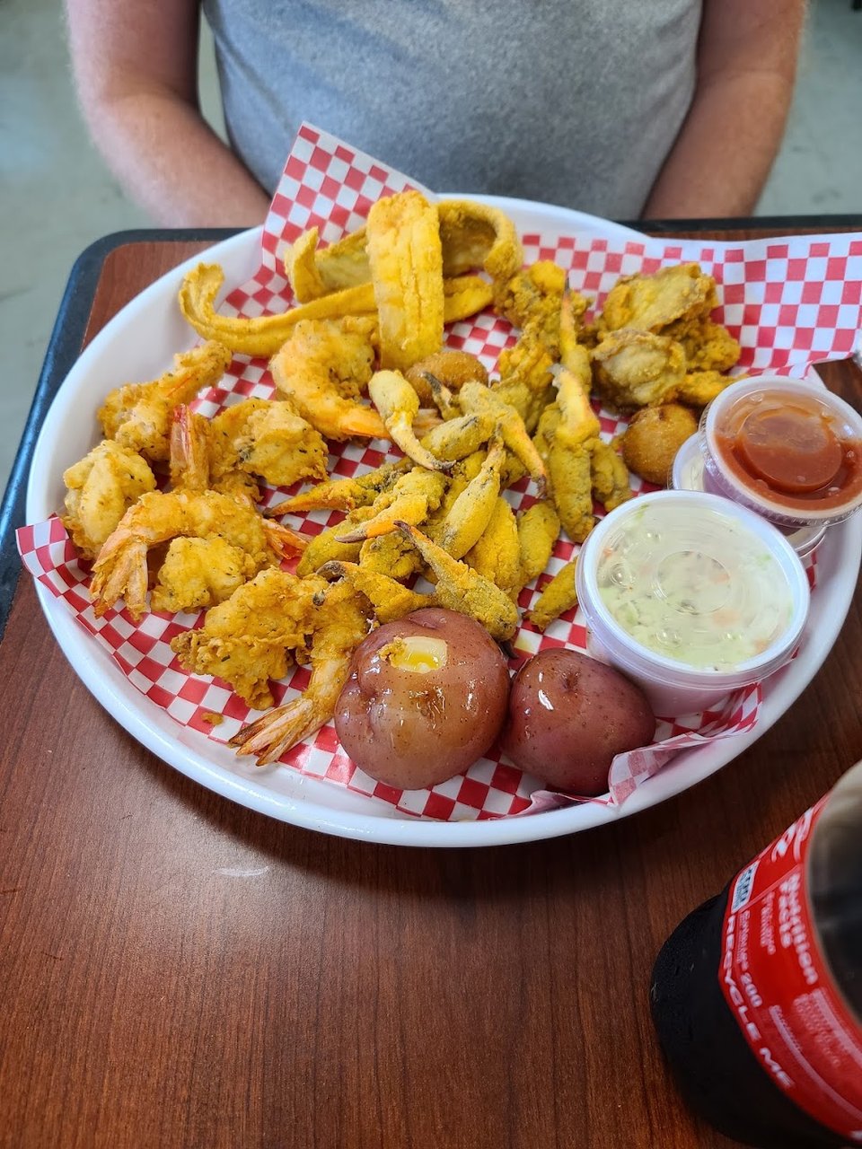 Counter menu featuring fried fish and shrimp burgers.